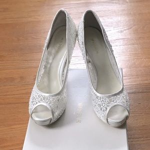 Menbur ivory embroidered peep toe pumps with crystal detail.